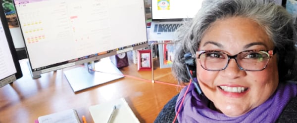 Woman working from home in front of her computer